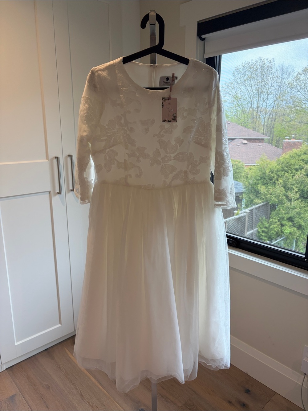 Dainty Jewells Clothier White Dress with Sequin Top and tulle skirt.
